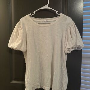 White large top with puffy sleeves.